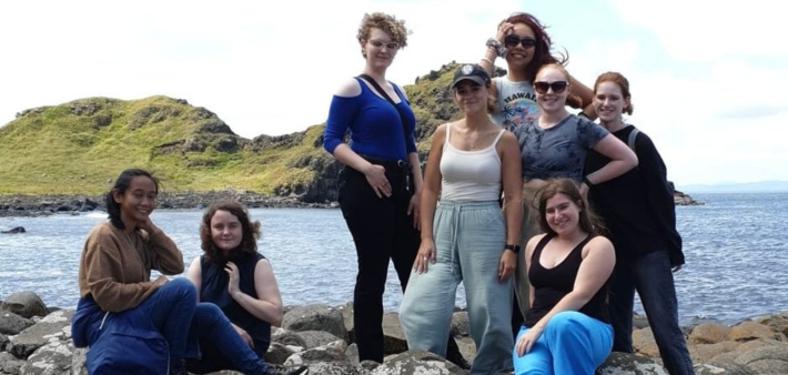 Students posing by water on their Irish Studies field trip